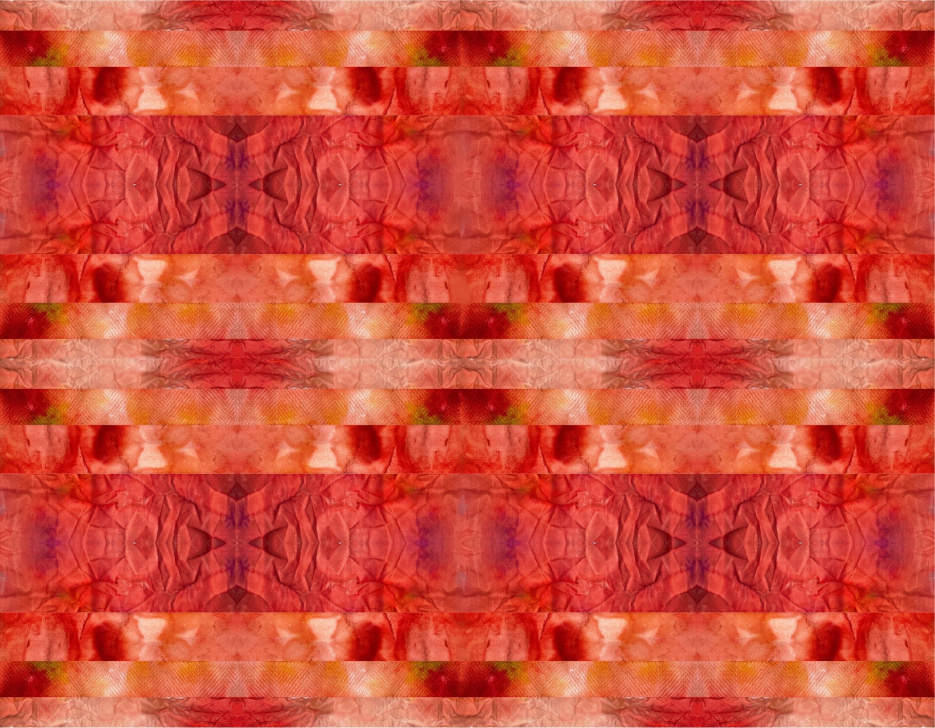 Base dyed fabric in red and orange tones before printing